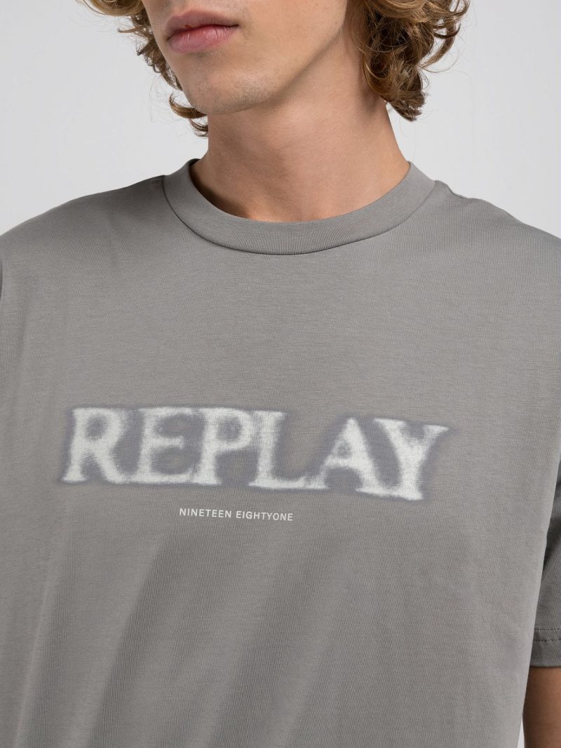grey military t shirt with blurry lettering